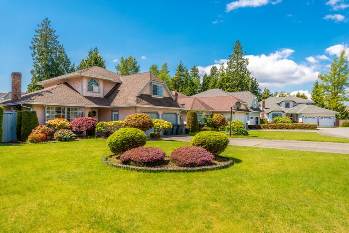 4K Suburban Houses with Well-Kept Lawn and Shrubs