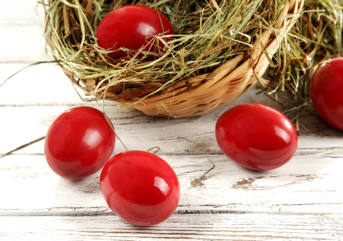 Red Easter Eggs in a Straw Nest