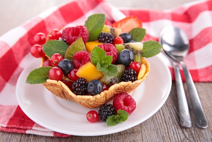 Fruit salad in a waffle bowl with mint
