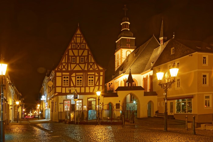 Night street in Kirchberg, Germany with historic houses and church