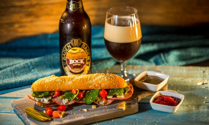 Baden Bock beer with a sandwich and condiments