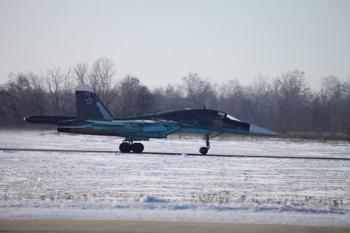 Sukhoi Su-34 fighter jet on a snowy runway