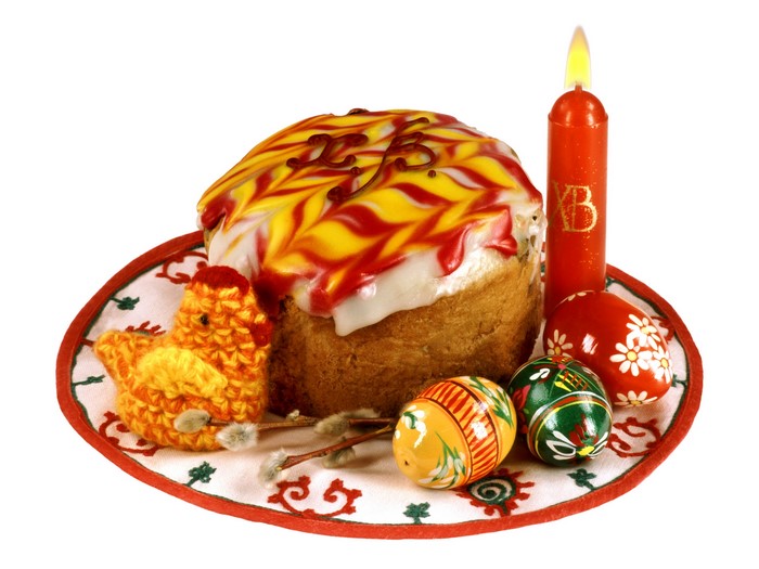 Easter Kulich with decorated eggs and candle