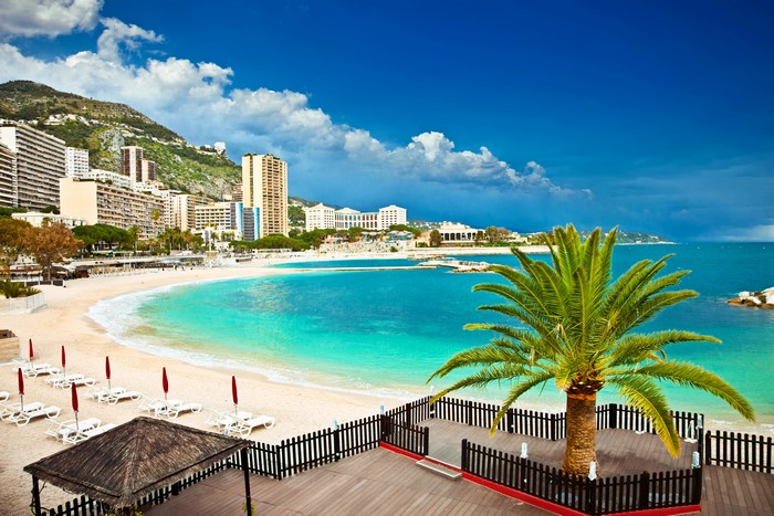 4K Monaco Beach with Palm Trees and Buildings