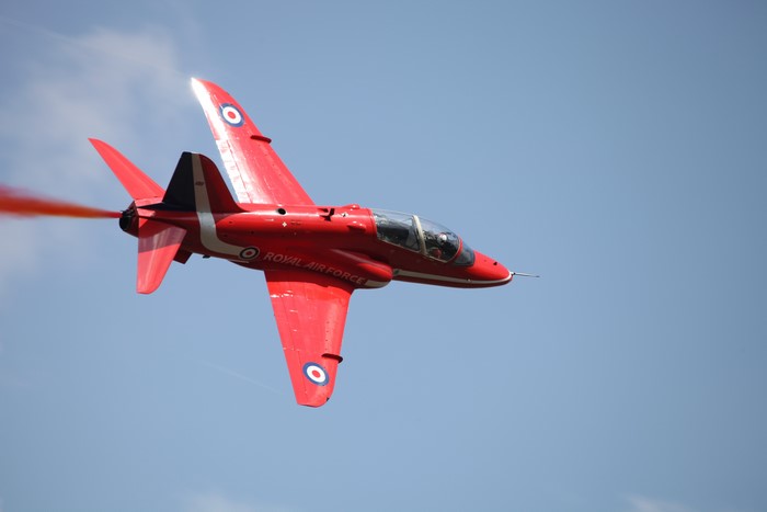 Red Arrows BAE Hawk T1 airplane performing aerobatics