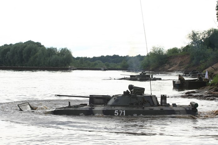 Amphibious IFVs crossing a river
