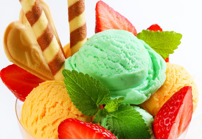 Ice cream sundae with strawberries and wafers