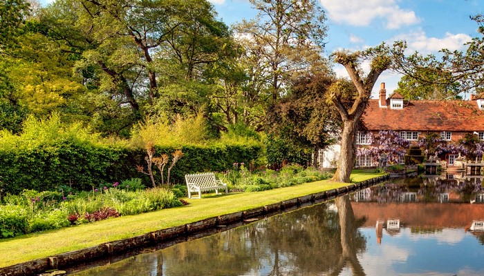 English country house with a pond and garden