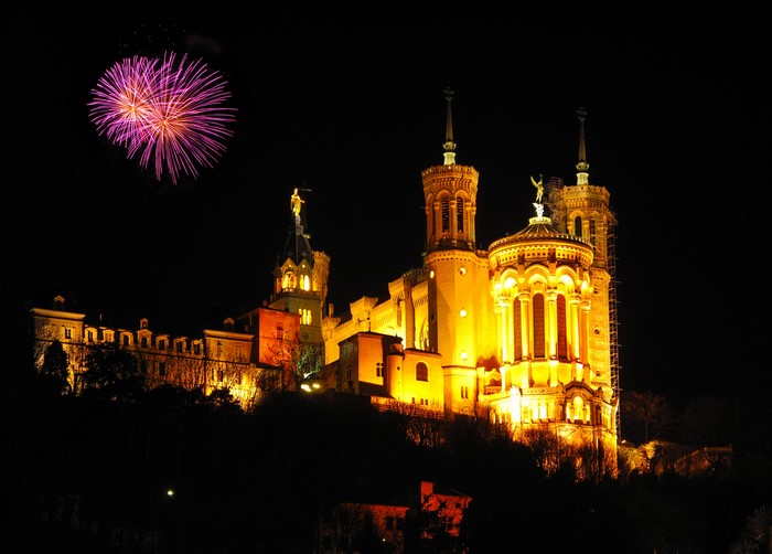Fireworks over Notre-Dame de Fourviere in Lyon, France at night