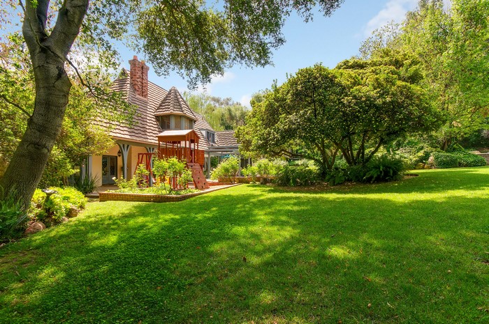 House with a playground and garden