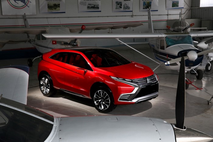 Red Mitsubishi XR-PHEV II concept car in hangar