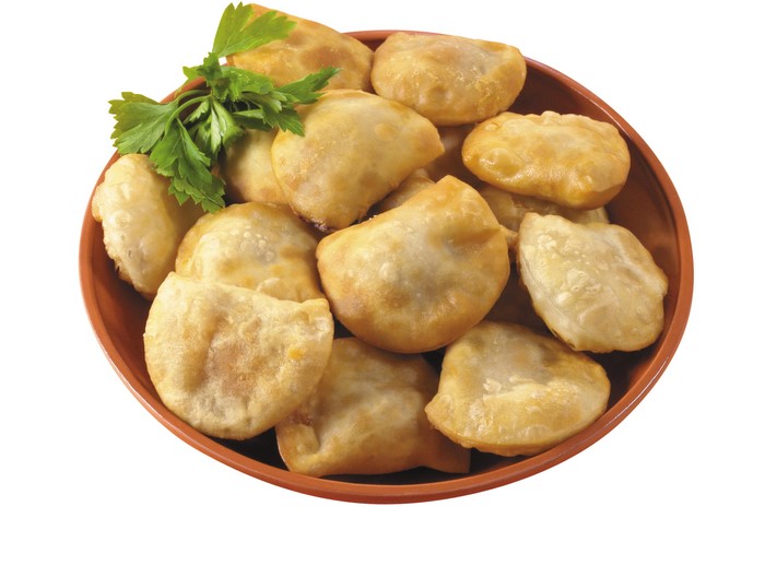 Fried dumplings in a bowl with parsley