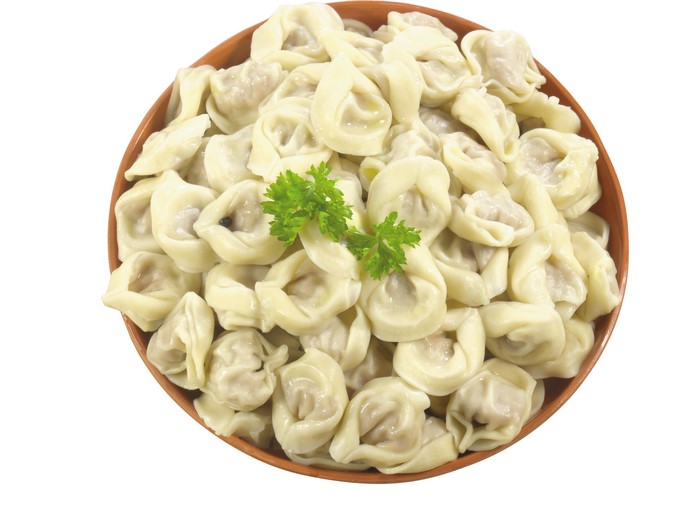 Pelmeni in a bowl with parsley