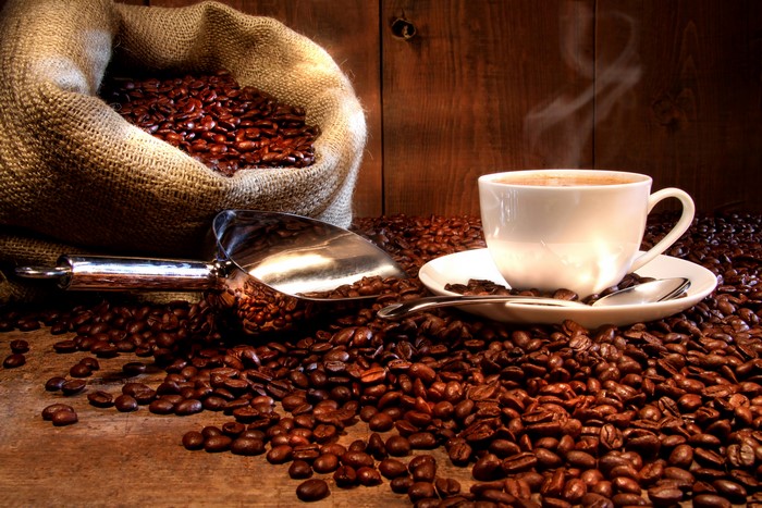 Coffee beans, cup, and scoop