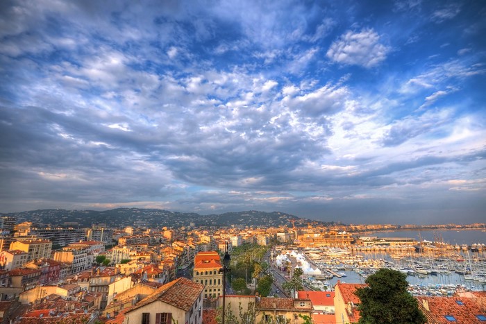 Cannes, France cityscape with harbor and mountains