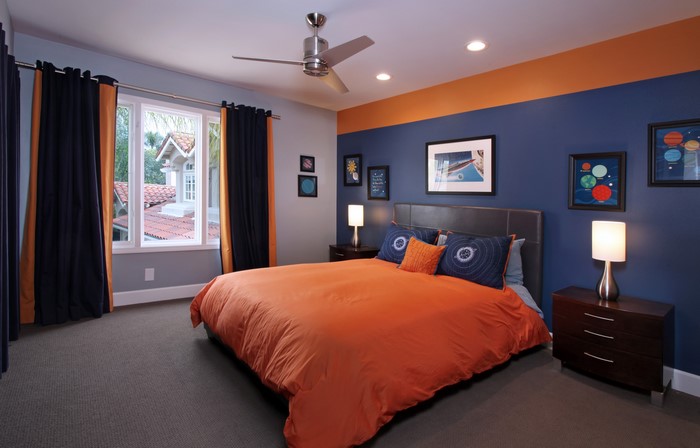 Modern bedroom with orange and blue decor