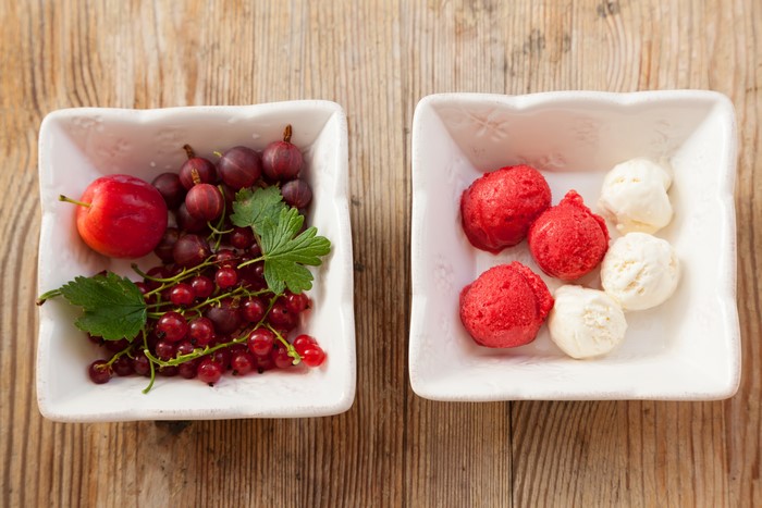 Berries and ice cream in bowls