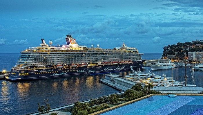 Cruise liner Mein Schiff in Monaco harbor at dusk