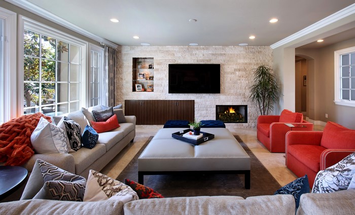 Living room with sofa, armchair, and fireplace