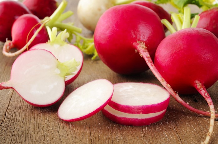 Radishes on a wooden surface
