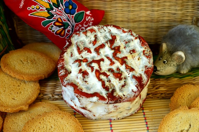 Cheese with crackers and a decorative mouse