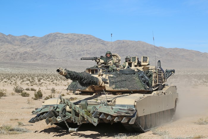 M1 Abrams tank with mine plow in desert