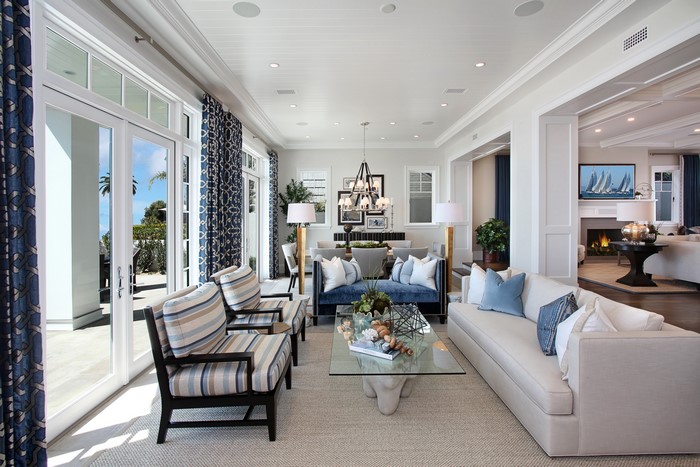Living room with sofas, armchairs, and chandelier