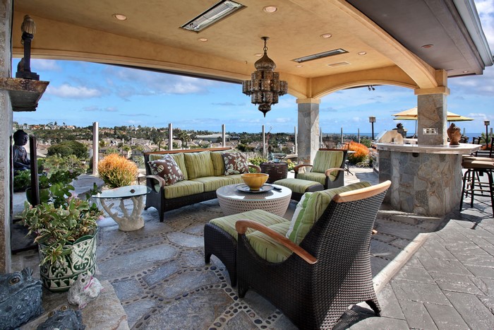 Covered patio with outdoor living room and bar