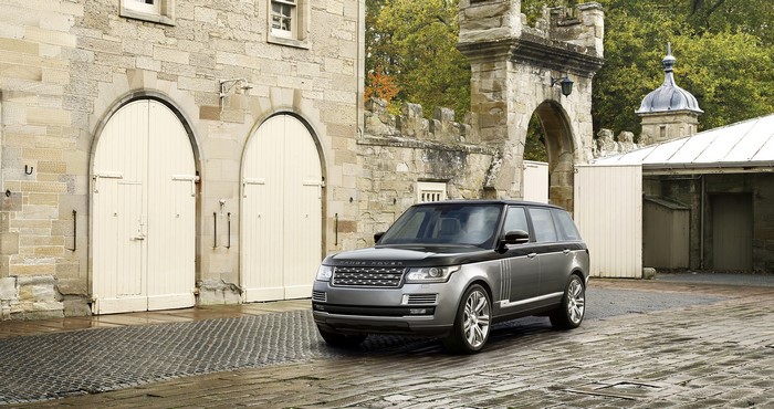 2015 Range Rover SV parked near stone building