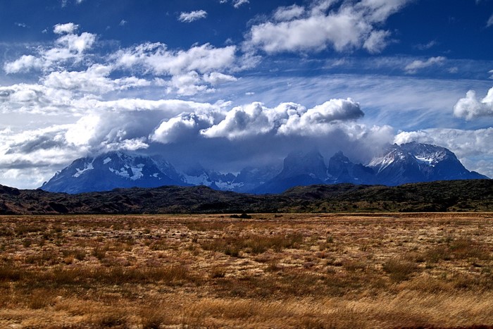 Patagonia Mountains and Grasslands under Cloudy Sky