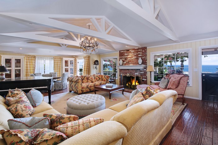 Living room with fireplace and ocean view