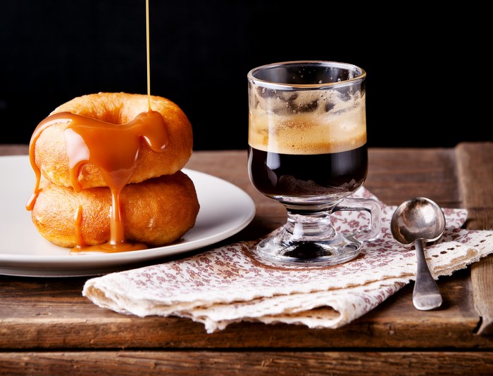 Donuts with caramel sauce and coffee