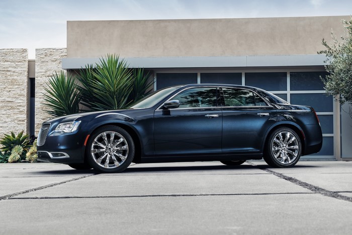 Blue Chrysler 300 C luxury sedan parked in driveway