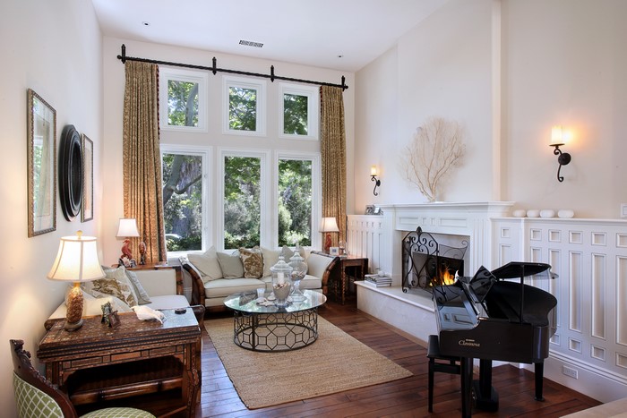 Living room with grand piano and fireplace