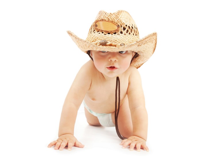 Baby boy wearing a cowboy hat