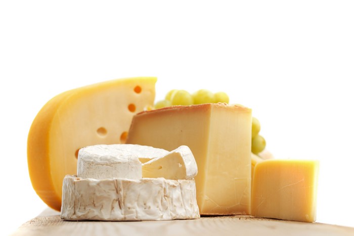 Assortment of cheeses and grapes