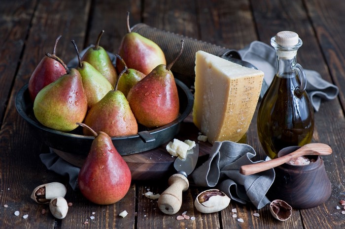 Pears, Cheese, Olive Oil, and Nuts on Wooden Table