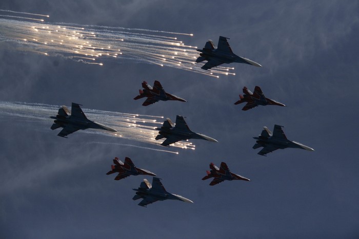 Russian fighter jets performing aerobatics with flares over Moscow