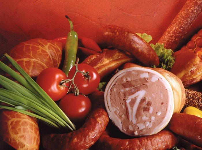Assortment of meat products with tomatoes and peppers