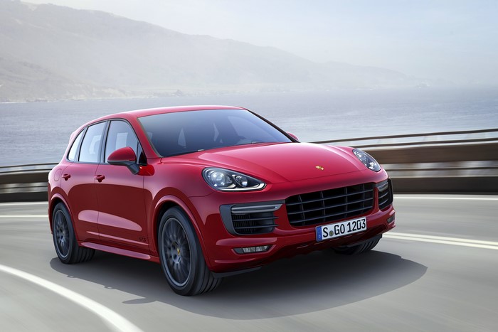 Red 2015 Porsche Cayenne GTS 4 on a road