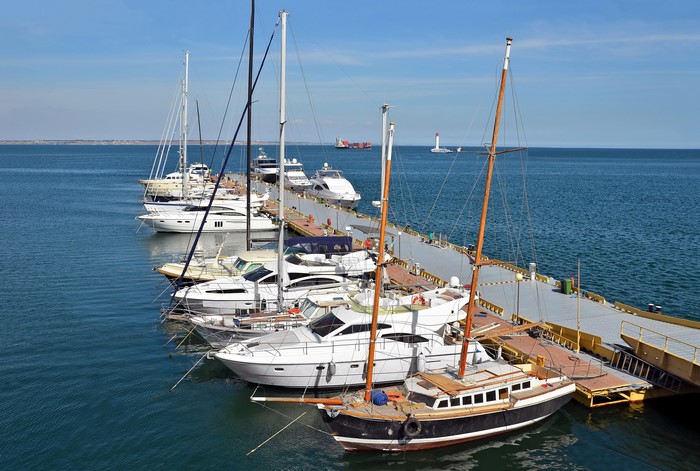 Yachts docked at a marina in Odessa on a clear day