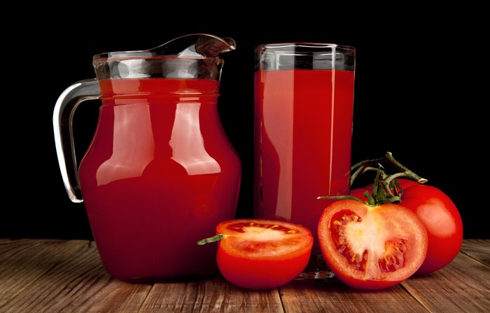 Tomato Juice in a Jug and Glass with Tomatoes