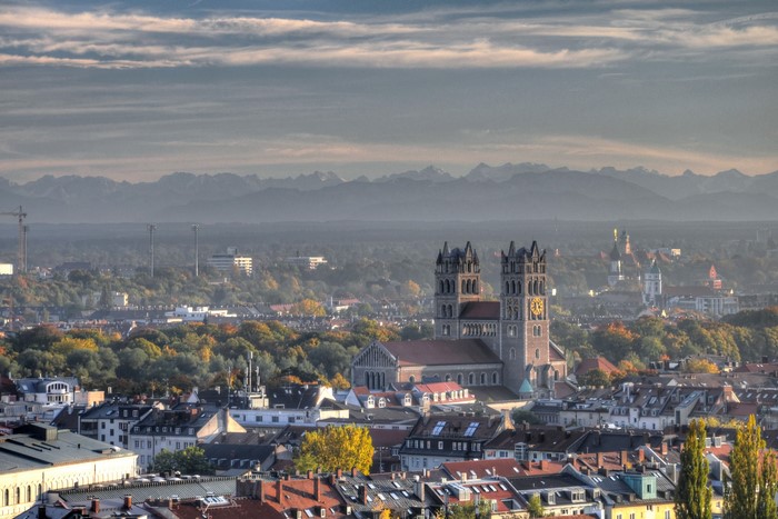 Munich cityscape with St. Mary's Church and Alps