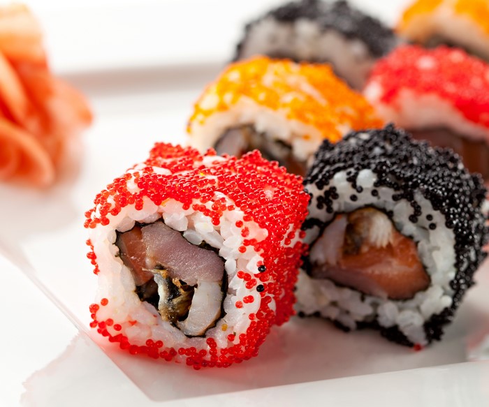 Sushi rolls with caviar and pickled ginger