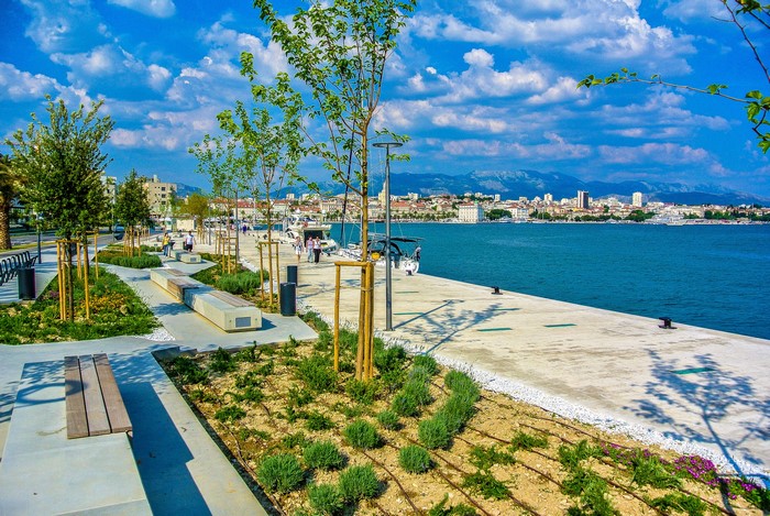 Split, Croatia waterfront promenade with city skyline