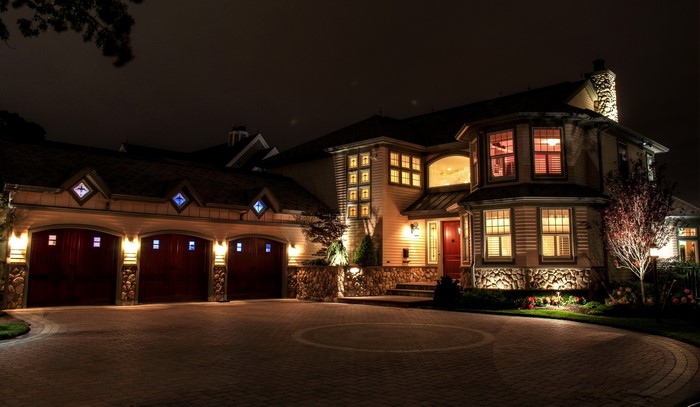 Luxury Mansion at Night with Garage