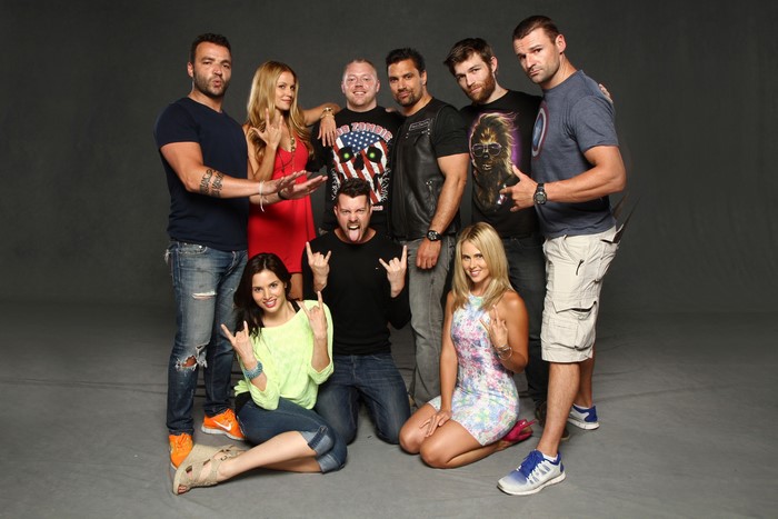 Group of actors posing for a photo