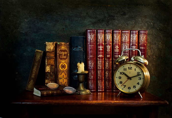 Vintage Books, Alarm Clock, and Candle