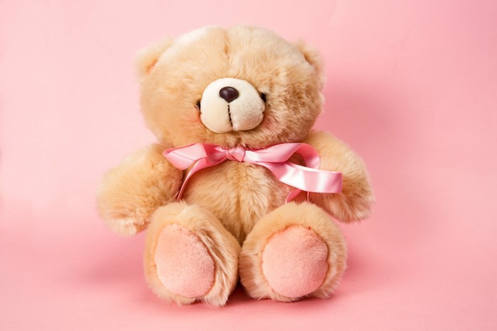 Teddy bear with pink ribbon