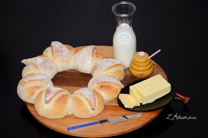Bread, Milk, Butter, and Honey on a Wooden Board